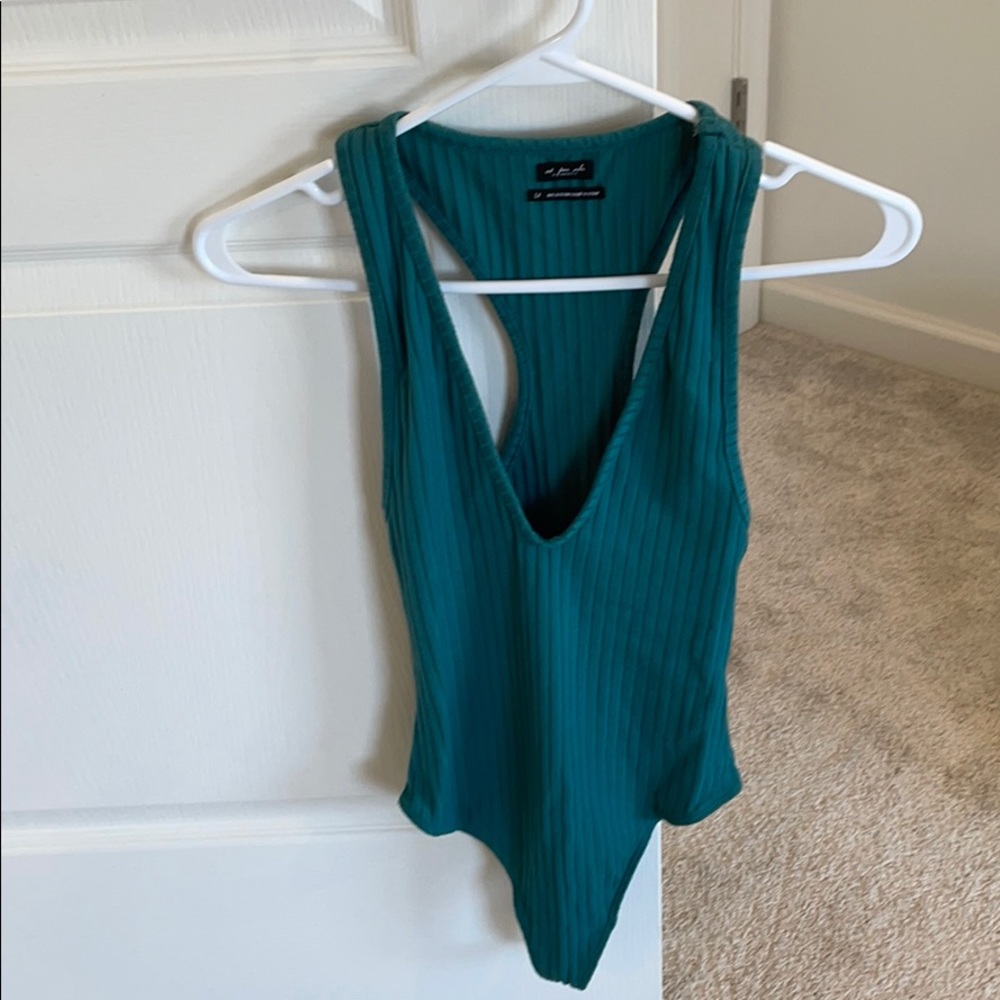 Out from under thong body suit, deep V-Neck